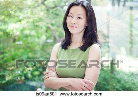 Mature woman smiling, portrait View Large Photo Image Stock Image - Mature woman smiling, portrait. Fotosearch