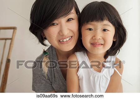 Mother and daughter smiling, portrait View Large Photo Image Stock Photograph - Mother and daughter smiling, portrait. Fotosearch