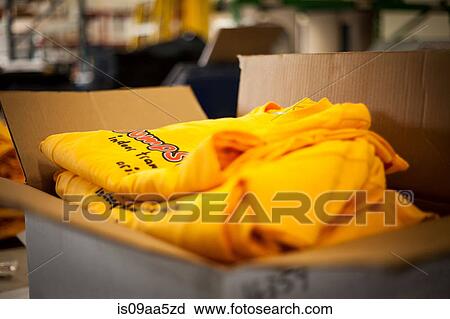 Open cardboard box containing screen printed t-shirts View Large Photo Image Stock Image - Open cardboard box containing screen printed t-shirts. Fotosearch