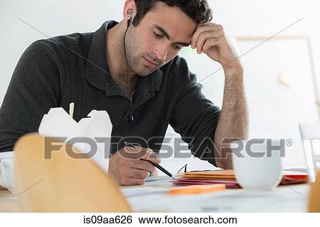 Portrait of male working through lunch View Large Photo Image Stock Photograph - Portrait of male working through lunch. Fotosearch