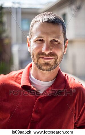 Stock Image - Portrait of small business manager outside warehouse. Fotosearch