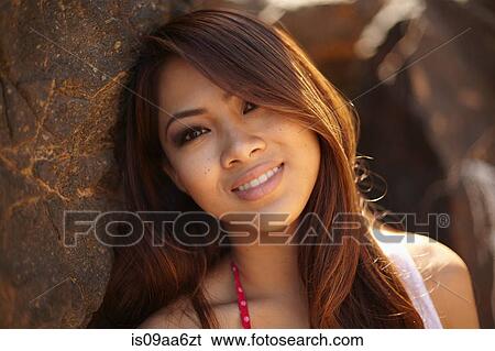 Stock Photograph - Portrait of smiling young woman. Fotosearch