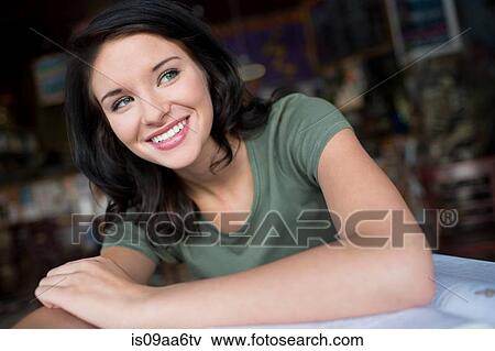 Stock Photo - Portrait of teenage girl in coffee house. Fotosearch
