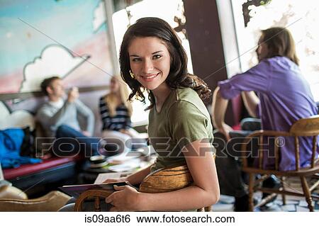 Portrait of teenager in cafe with study group View Large Photo Image Stock Photograph - Portrait of teenager in cafe with study group. Fotosearch