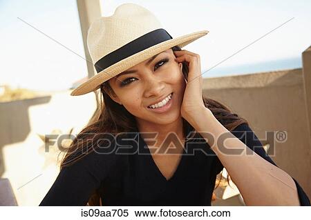 Portrait of young woman in hat, Palos Verdes, California, USA View Large Photo Image Stock Photography - Portrait of young woman in hat, Palos Verdes, California, USA. Fotosearch