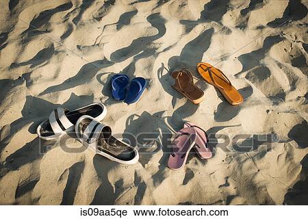 Sandals on sandy beach View Large Photo Image Stock Image - Sandals on sandy beach. Fotosearch