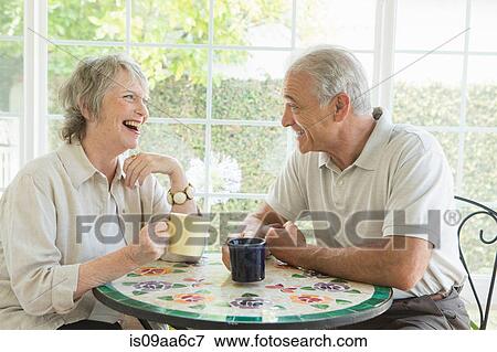 Senior couple at table in conservatory View Large Photo Image Stock Photo - Senior couple at table in conservatory. Fotosearch