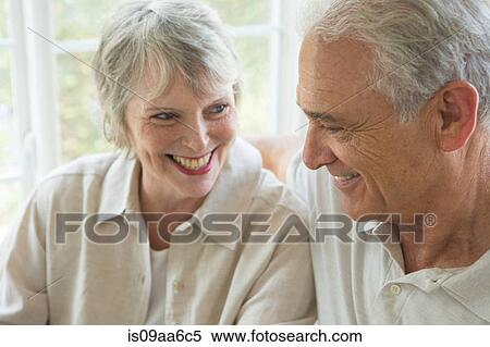 Stock Photography - Senior couple smiling together, close up. Fotosearch