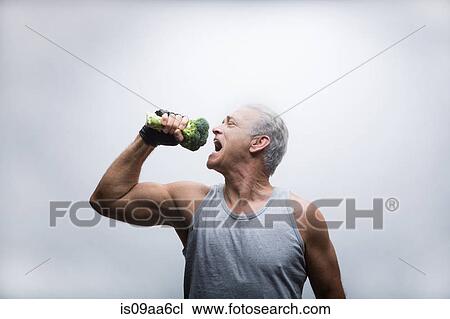 Senior man about to eat broccoli View Large Photo Image Stock Image - Senior man about to eat broccoli. Fotosearch