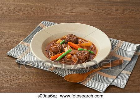 Still life of casserole garnished with carrots and green beans View Large Photo Image Stock Photo - Still life of casserole garnished with carrots and green beans. Fotosearch