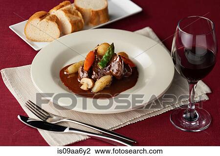 Still life of casserole with red wine and bread View Large Photo Image Stock Image - Still life of casserole with red wine and bread. Fotosearch