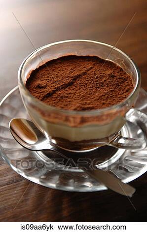 Still life of cup of coffee dessert with chocolate powder on top View Large Photo Image Stock Image - Still life of cup of coffee dessert with chocolate powder on top. Fotosearch