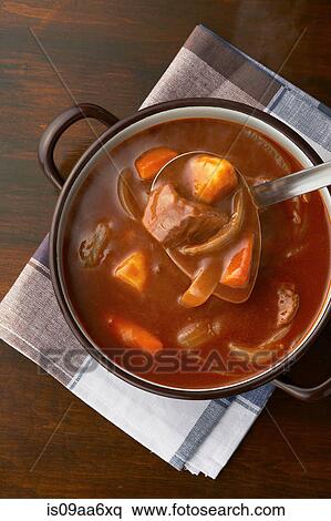 Still life of ladle serving from casserole dish View Large Photo Image Stock Photography - Still life of ladle serving from casserole dish. Fotosearch