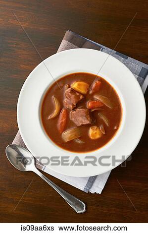Still life of meat and vegetable casserole serving in bowl View Large Photo Image Stock Photograph - Still life of meat and vegetable casserole serving in bowl. Fotosearch