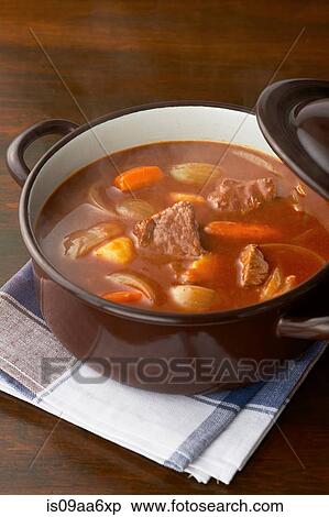 Stock Photography - Still life of meat and vegetables in casserole dish. Fotosearch