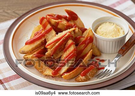 Still life of plate with chips covered in tomato sauce View Large Photo Image Picture - Still life of plate with chips covered in tomato sauce. Fotosearch