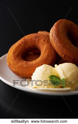 Still life with doughnuts and ice cream View Large Photo Image Picture - Still life with doughnuts and ice cream. Fotosearch