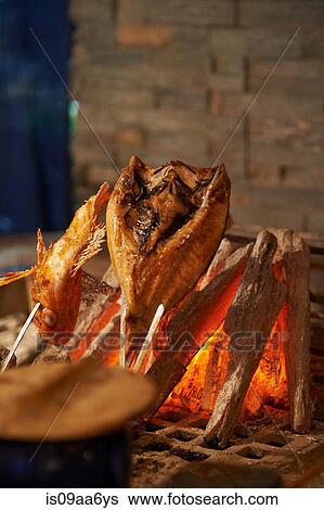Still life with fish cooking on charcoal View Large Photo Image Stock Photograph - Still life with fish cooking on charcoal. Fotosearch