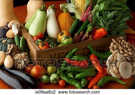 Stock Image - Still life with selection of vegetables and mushrooms. Fotosearch