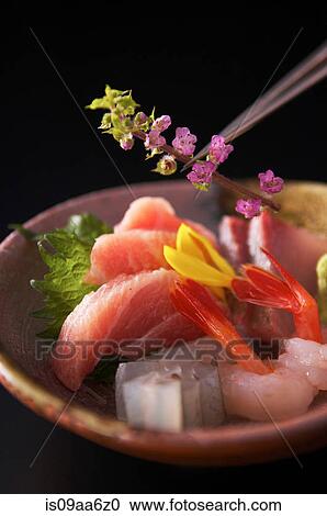 Stock Image - Still life with sushi and flower blossoms. Fotosearch