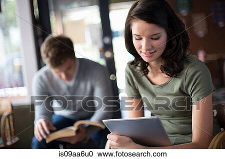 Study group working in coffee house View Large Photo Image Stock Image - Study group working in coffee house. Fotosearch