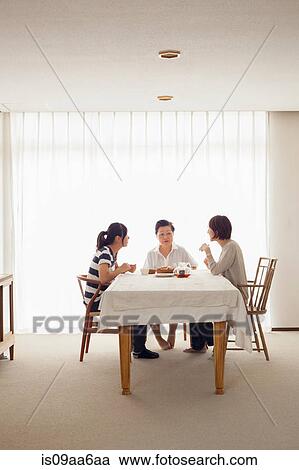 Three generation family at table View Large Photo Image Stock Image - Three generation family at table. Fotosearch