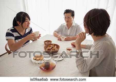 Three generation family at table View Large Photo Image Stock Image - Three generation family at table. Fotosearch