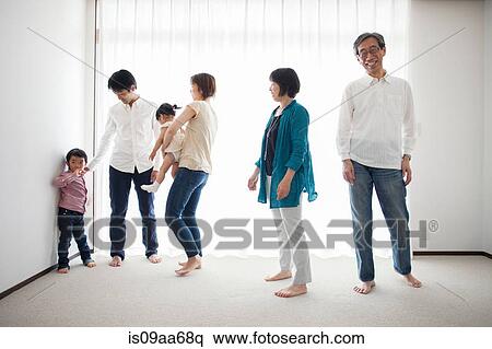 Three generation family by window View Large Photo Image Stock Photography - Three generation family by window. Fotosearch