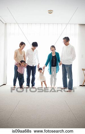 Three generation family holding hands, portrait View Large Photo Image Stock Photograph - Three generation family holding hands, portrait. Fotosearch
