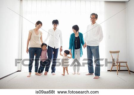 Three generation family holding hands, portrait View Large Photo Image Stock Photograph - Three generation family holding hands, portrait. Fotosearch