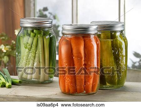 Three jars of pickled vegetables on windowsill View Large Photo Image Picture - Three jars of pickled vegetables on windowsill. Fotosearch