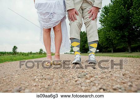 View of couples legs on wedding day View Large Photo Image Stock Image - View of couples legs on wedding day. Fotosearch
