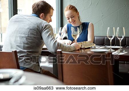 Young couple in restaurant View Large Photo Image Stock Image - Young couple in restaurant. Fotosearch