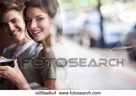 Young couple inside cafe View Large Photo Image Picture - Young couple inside cafe. Fotosearch