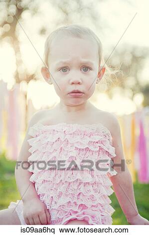 Stock Photography - Young girl looking upset, portrait. Fotosearch