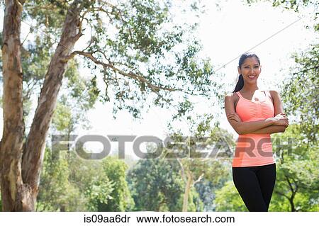 Stock Photography - Young woman in park, portrait. Fotosearch