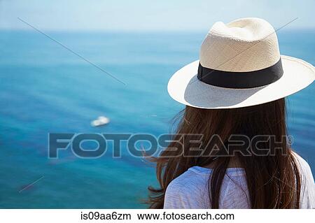 Picture - Young woman looking out to sea, Palos Verdes, California, USA. Fotosearch