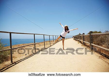 Stock Image - Young woman messing around, Palos Verdes, California, USA. Fotosearch