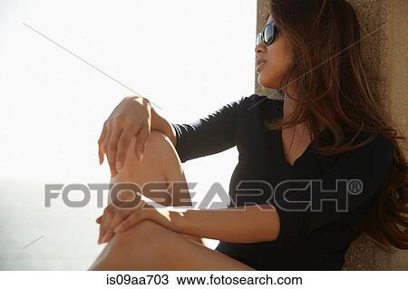Stock Image - Young woman relaxing, Palos Verdes, California, USA. Fotosearch