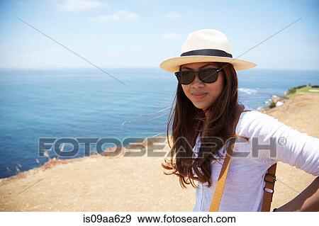 Young woman wearing sunhat at coast Palos Verdes, California, USA View Large Photo Image Stock Photo - Young woman wearing sunhat at coast Palos Verdes, California, USA. Fotosearch