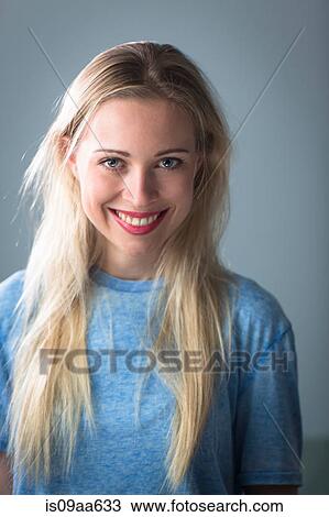 Young woman with long blonde hair smiling, portrait View Large Photo Image Stock Image - Young woman with long blonde hair smiling, portrait. Fotosearch