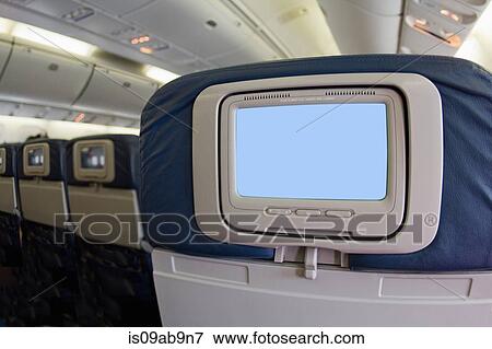 Stock Photo - Airline video screen on back of seat. Fotosearch