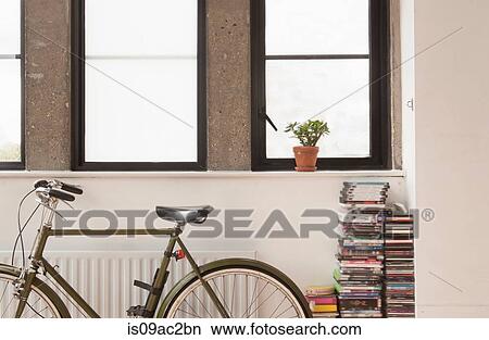 Apartment interior with bicycle and cd collection View Large Photo Image Picture - Apartment interior with bicycle and cd collection. Fotosearch