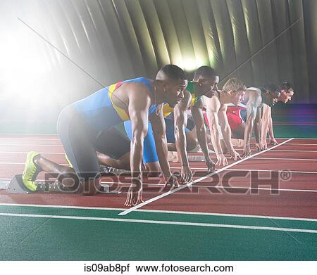 Stock Image - Athletes on start line of race. Fotosearch