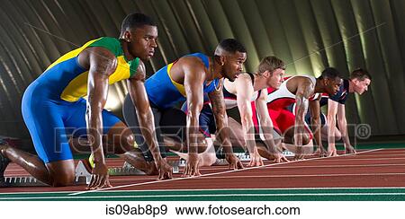 Stock Photo - Athletes on start line of race. Fotosearch