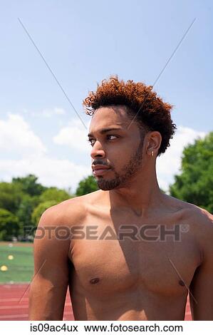 Stock Photo - Athletic young man with bare chest. Fotosearch