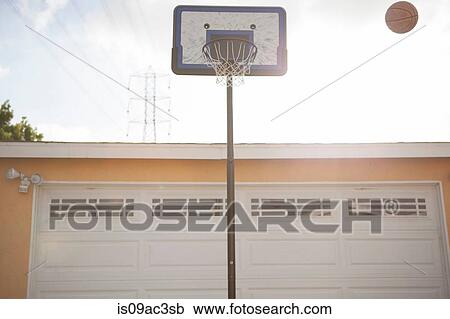 Basketball hoop and ball outside garage View Large Photo Image Stock Image - Basketball hoop and ball outside garage. Fotosearch