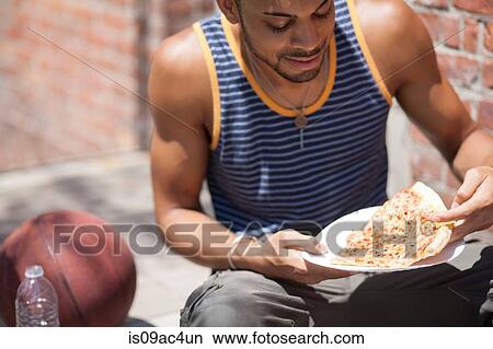 Basketball player with a slice of pizza View Large Photo Image Picture - Basketball player with a slice of pizza. Fotosearch