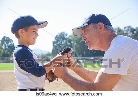 Boy and grandfather holding baseball mitt View Large Photo Image Stock Photography - Boy and grandfather holding baseball mitt. Fotosearch