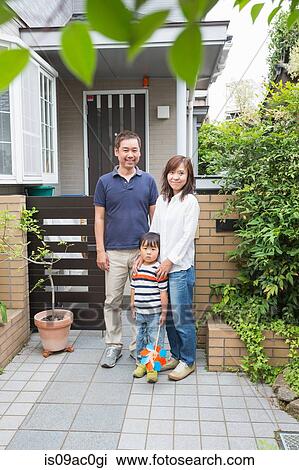 Boy and parents outside home View Large Photo Image Stock Image - Boy and parents outside home. Fotosearch